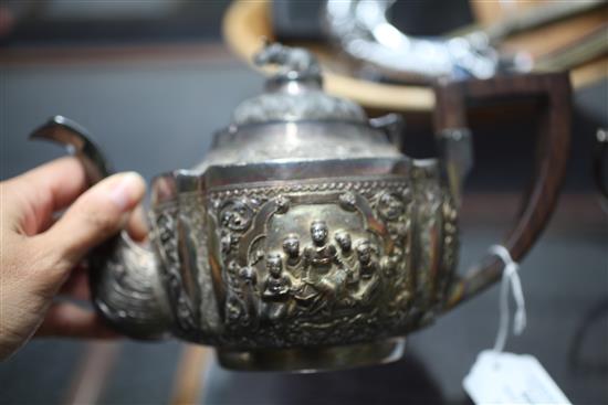 A heavy late 19th century Indian three piece silver tea set,